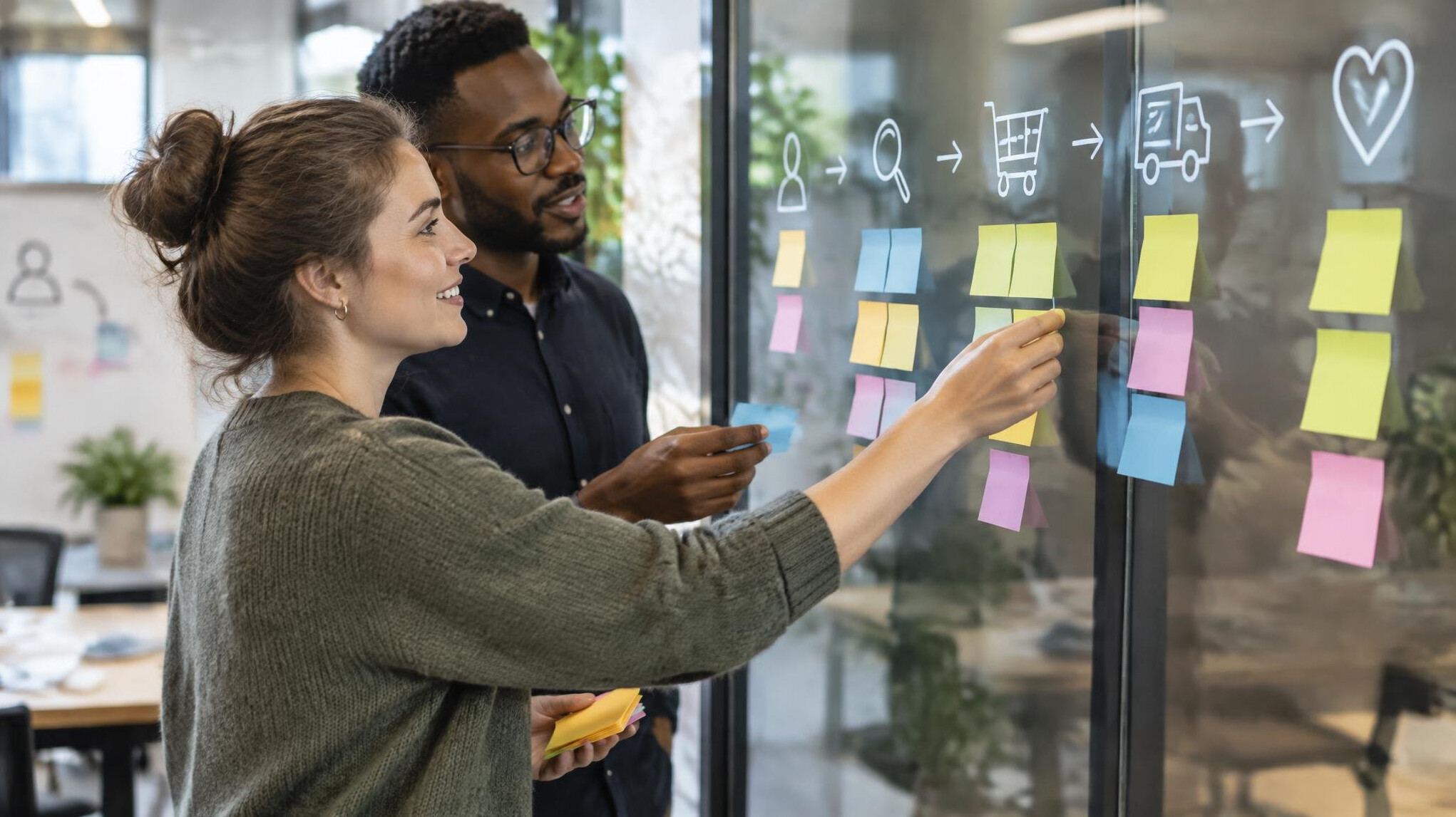Team workshop with sticky notes on a wall